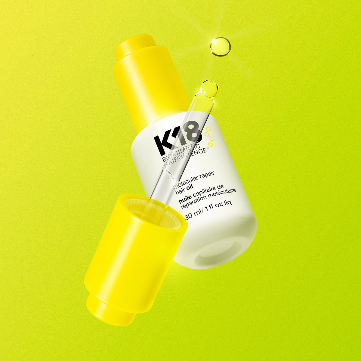 Huile capillaire K18 Molecular Repair Hair Oil avec pipette apparente et capuchon jaune, entourée de gouttes sur fond jaune citron.