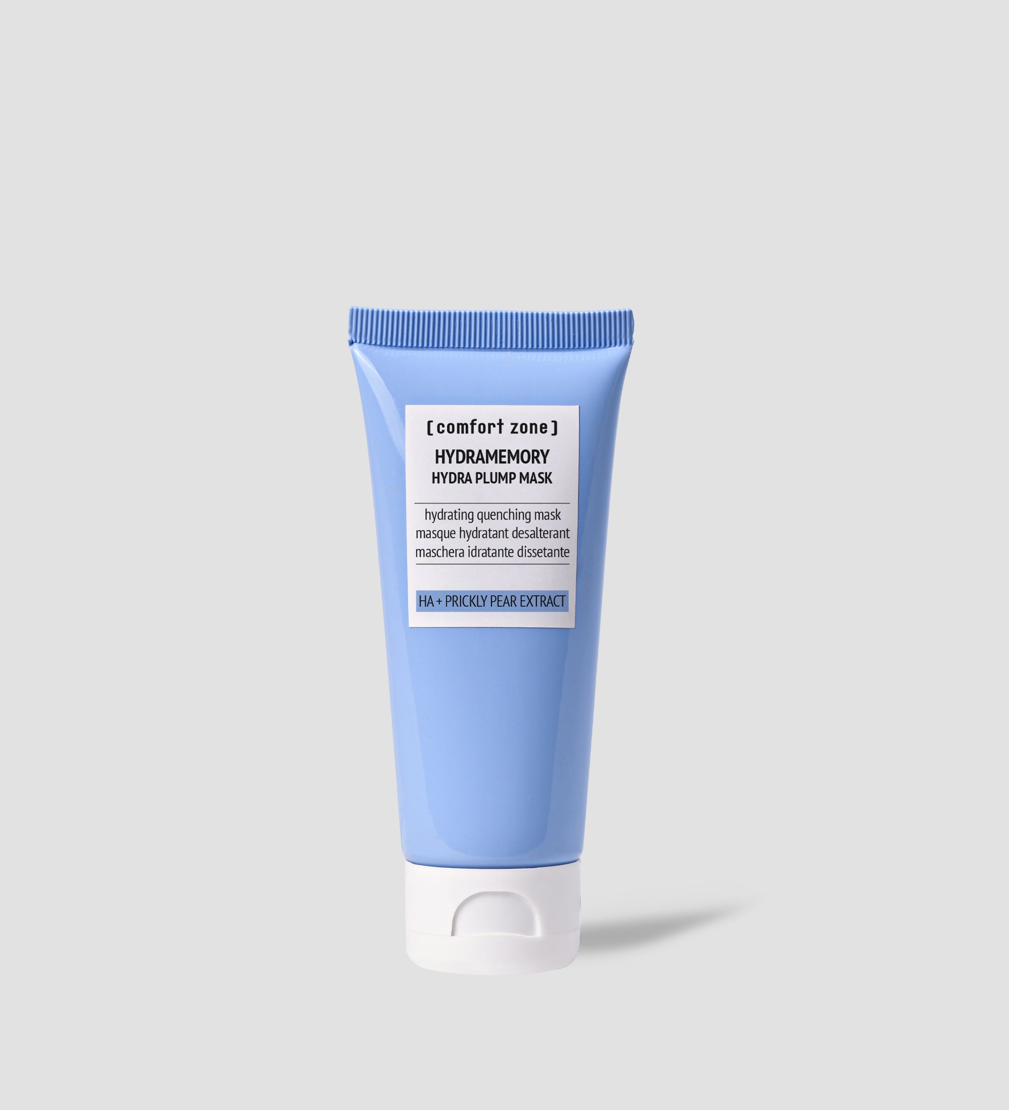 Produit de soin Comfort Zone Hydramemory Hydra Plump Mask dans un tube bleu avec un bouchon blanc. Le texte sur le tube indique qu'il s'agit d'un masque hydratant désaltérant avec de l'acide hyaluronique et un extrait de figue de barbarie.