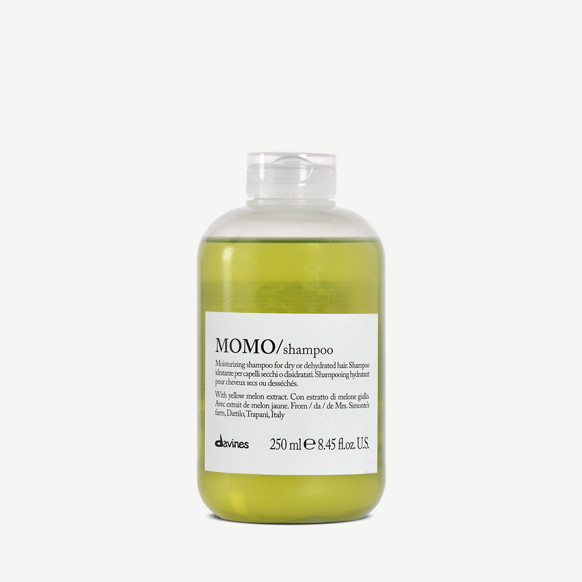 Flacon de 250 ml du shampoing hydratant Davines MOMO, enrichi en extrait de melon jaune, conçu pour nourrir en profondeur et hydrater les cheveux secs ou déshydratés