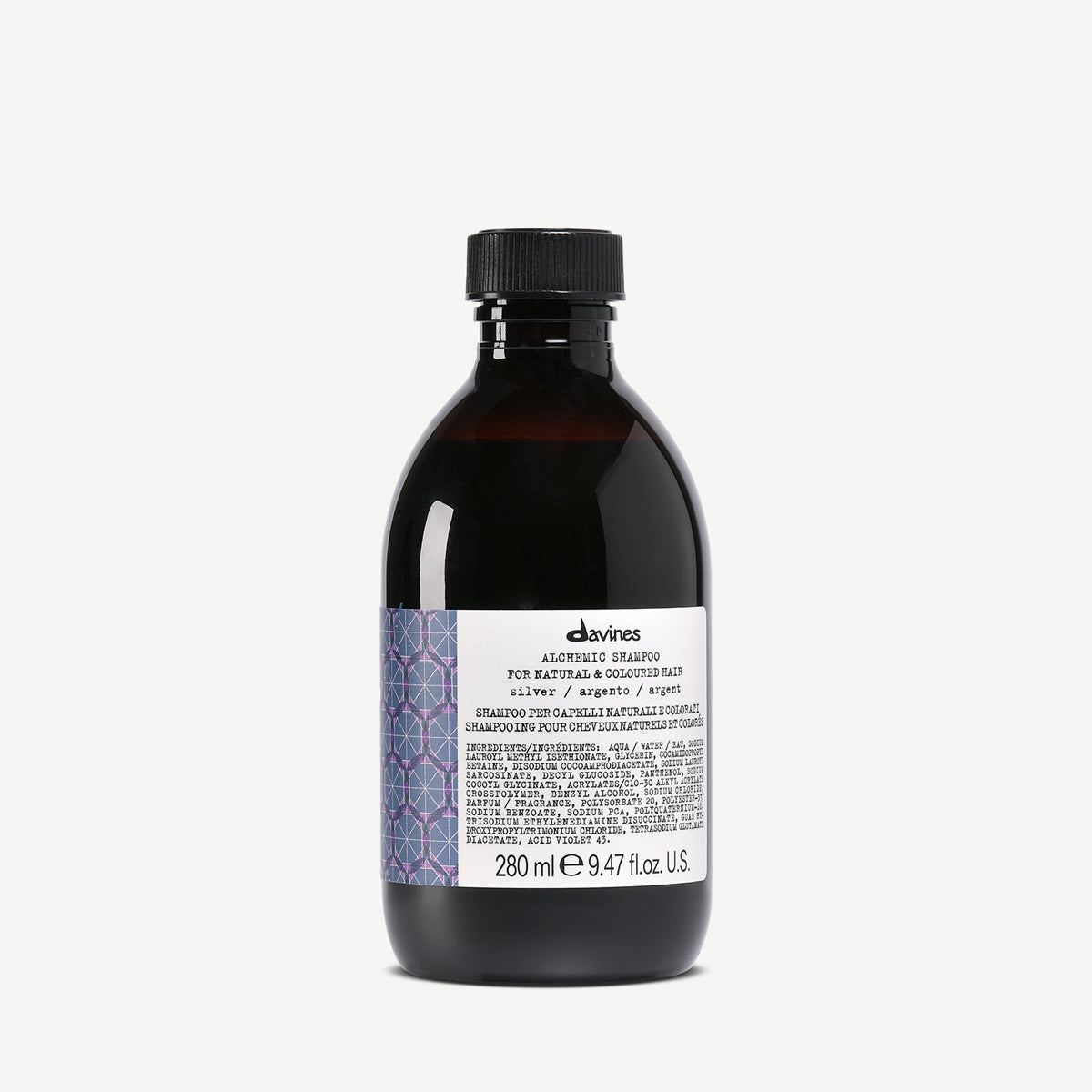 DAVINES - ALCHEMIC SHAMPOO SILVER Une bouteille de shampooing Davines Alchemic Silver pour cheveux naturels et colorés. Le produit est présenté dans une bouteille foncée de 280 ml, avec une étiquette contenant les informations d'utilisation et les ingrédients.