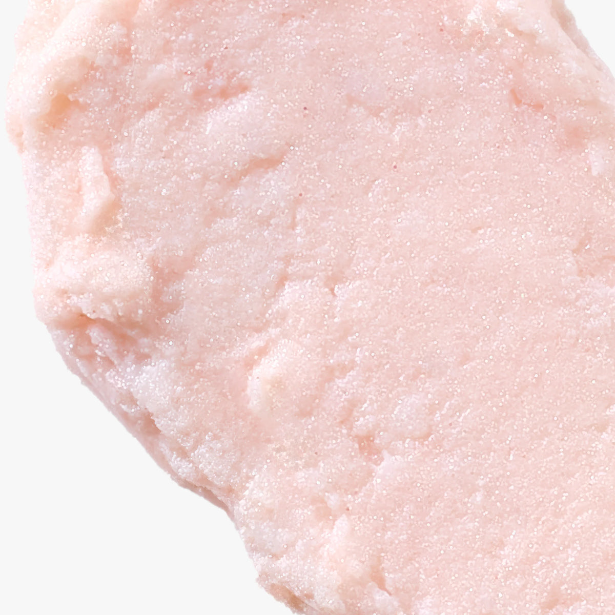 Gros plan sur la texture rose pâle et nacrée du Luminant Revital-Eye Stick.