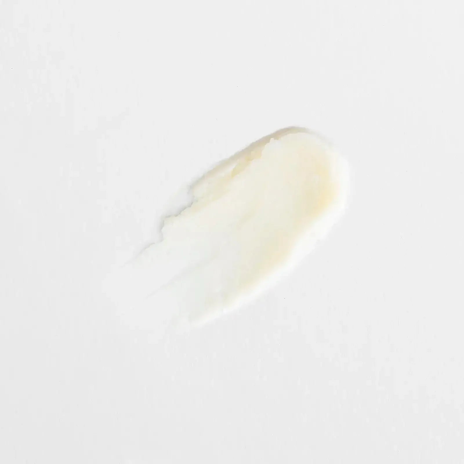 Texture fondante du déodorant baume 48H parfum monoï Endro Cosmétiques sur fond clair.