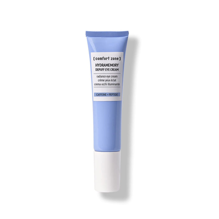 Crème contour des yeux Comfort Zone Hydramemory Depuff, enrichie en caféine et peptides. Soin éclat et hydratation pour réduire les poches et illuminer le regard. Tube bleu minimaliste avec bouchon blanc, cosmétique clean beauty.