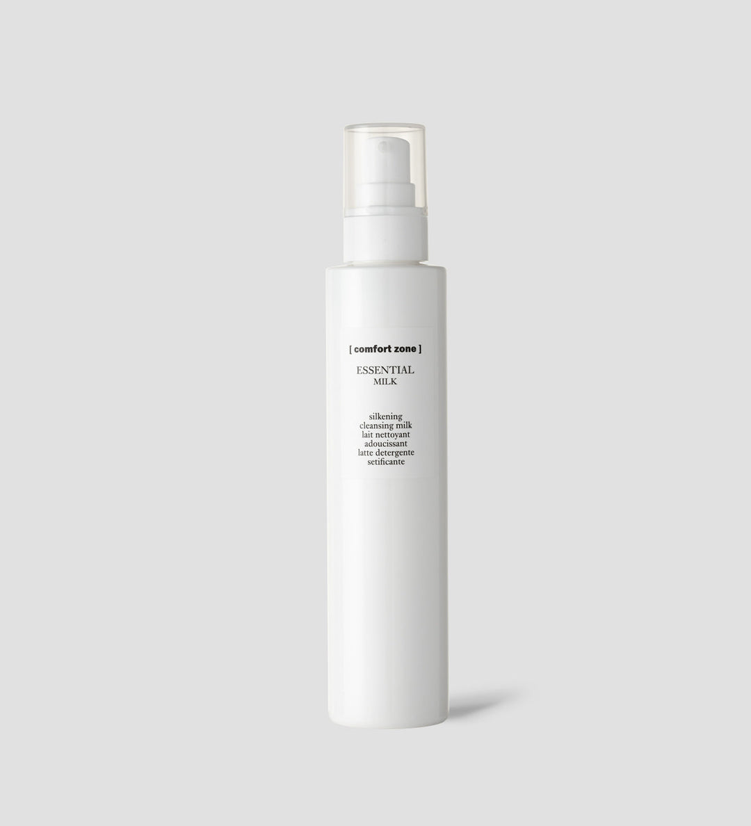 Bouteille de Comfort Zone Essential Milk, lait nettoyant adoucissant, sur fond gris clair.
