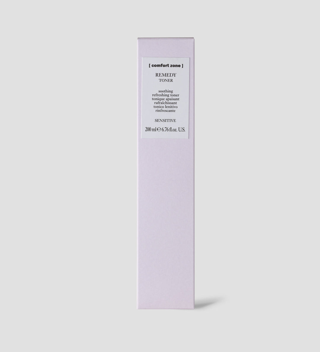 Boîte du toner apaisant Remedy de Comfort Zone sur un fond gris clair. La boîte est violette avec une étiquette blanche indiquant "Remedy Toner".