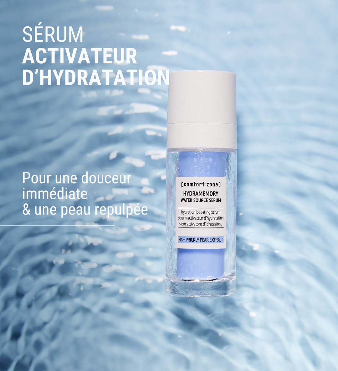 Affiche publicitaire de [comfort zone] montrant le sérum Hydramemory Water Source Serum. Le texte "Sérum activateur d'hydratation" figure en haut, avec la mention "Pour une douceur immédiate & une peau repulpée". Le sérum est présenté en flacon pompe, placé sur un fond bleu évoquant l'eau.