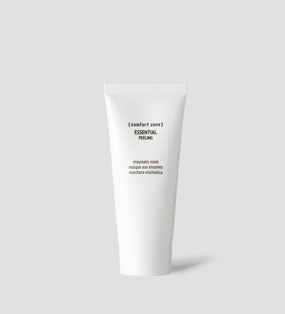 Tube de Comfort Zone Essential Peeling, masque enzymatique, sur fond gris clair.
