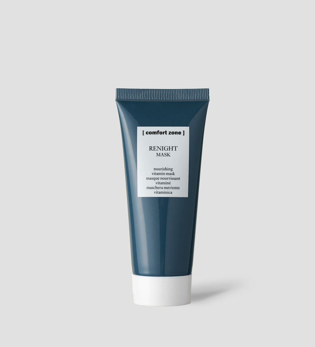 Tube du masque Renight de Comfort Zone sur un fond gris clair. Le tube est bleu foncé avec un bouchon blanc et une étiquette blanche indiquant "Renight Mask".