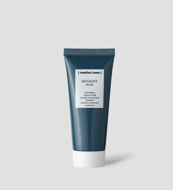 Tube du masque Renight de Comfort Zone sur un fond gris clair. Le tube est bleu foncé avec un bouchon blanc et une étiquette blanche indiquant "Renight Mask".