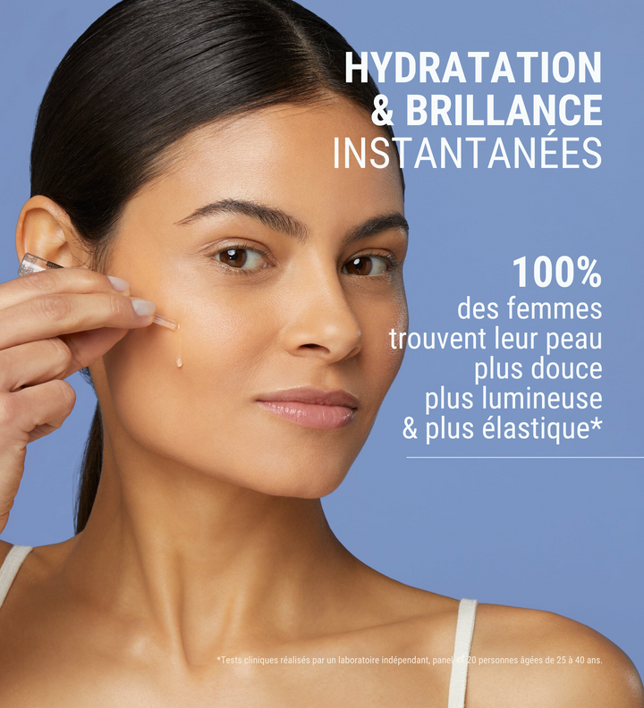 Affiche publicitaire de [comfort zone] pour les ampoules Hydramemory Hydra & Glow, mettant en avant une femme appliquant le produit sur son visage. Le texte indique "Hydratation & Brillance Instantanées" avec 100% des femmes trouvant leur peau plus douce, plus lumineuse et plus élastique. Fond bleu clair avec des mentions de tests cliniques réalisés par un laboratoire indépendant sur un panel de 20 personnes âgées de 25 à 40 ans.