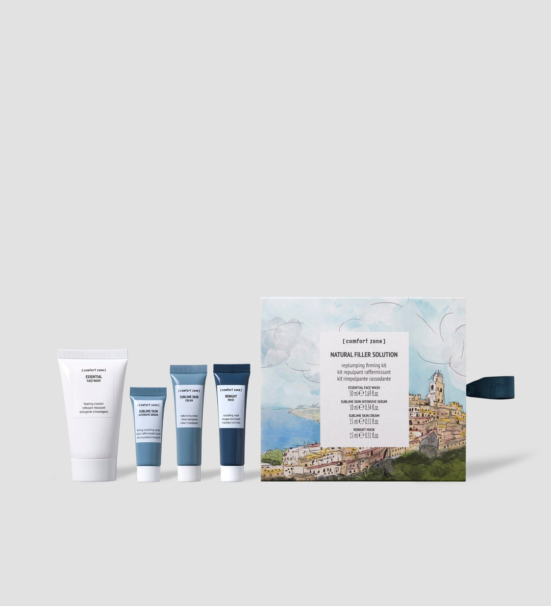 Kit de soins de la peau Comfort Zone Natural Filler Solution. Ce kit repulpant et raffermissant comprend plusieurs produits en format voyage, idéal pour revitaliser et raffermir la peau. La boîte illustrée présente une vue pittoresque, ajoutant une touche esthétique à l'ensemble.