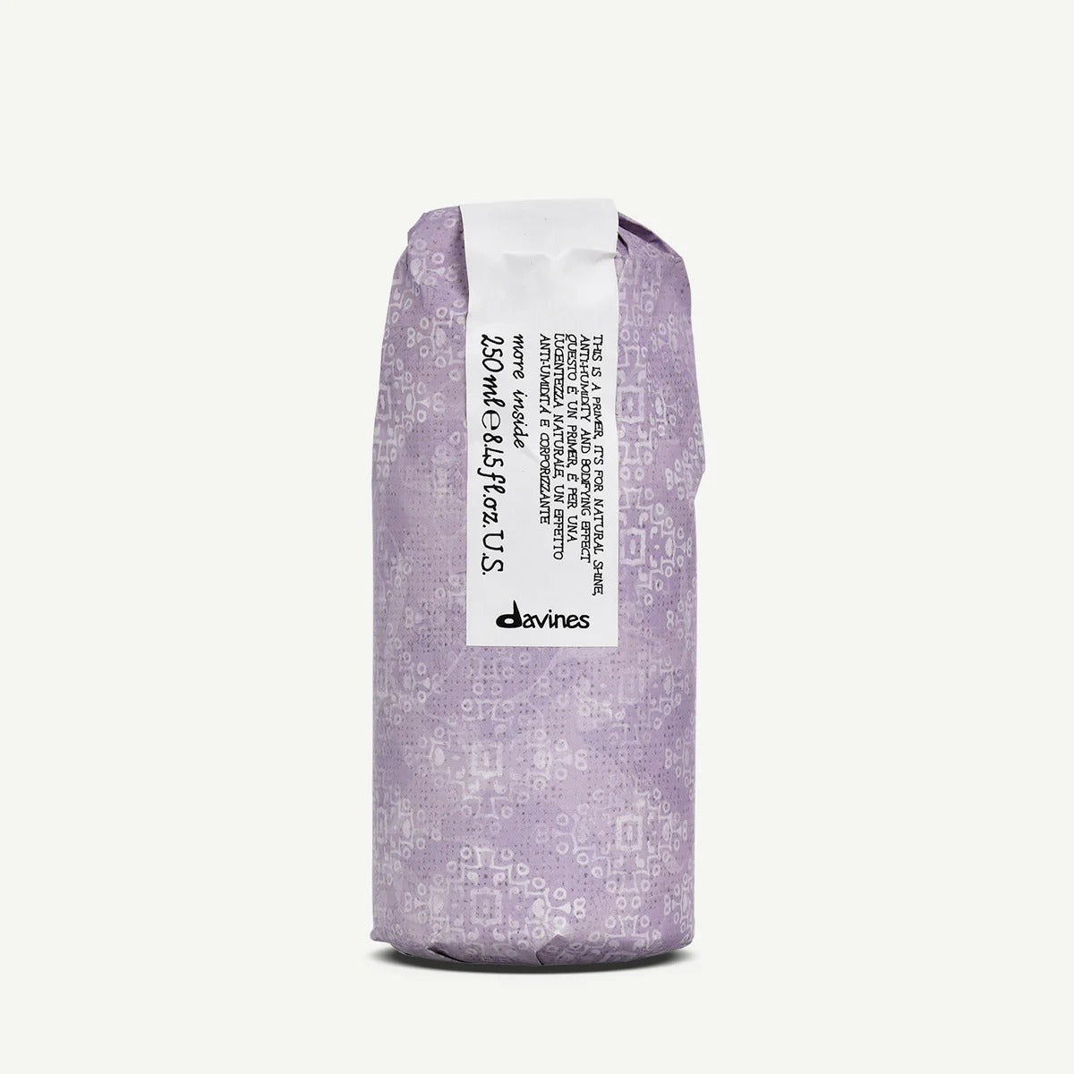 Spray pré-coiffage Davines Blow-Dry Primer 250 ml enveloppé dans son papier violet More Inside