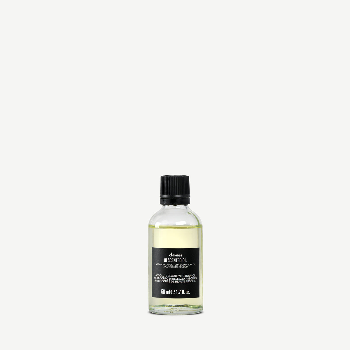 Flacon Davines OI Scented Oil 50 ml, huile corps parfumée au roucou, sur fond clair.