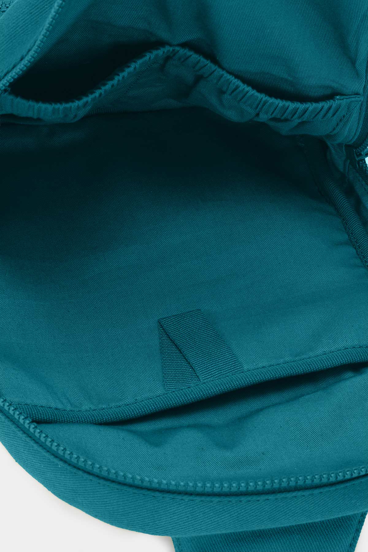 Interieur du Sling Bag Felix Bleu Paon avec compartiment de rangement en coton recycle
